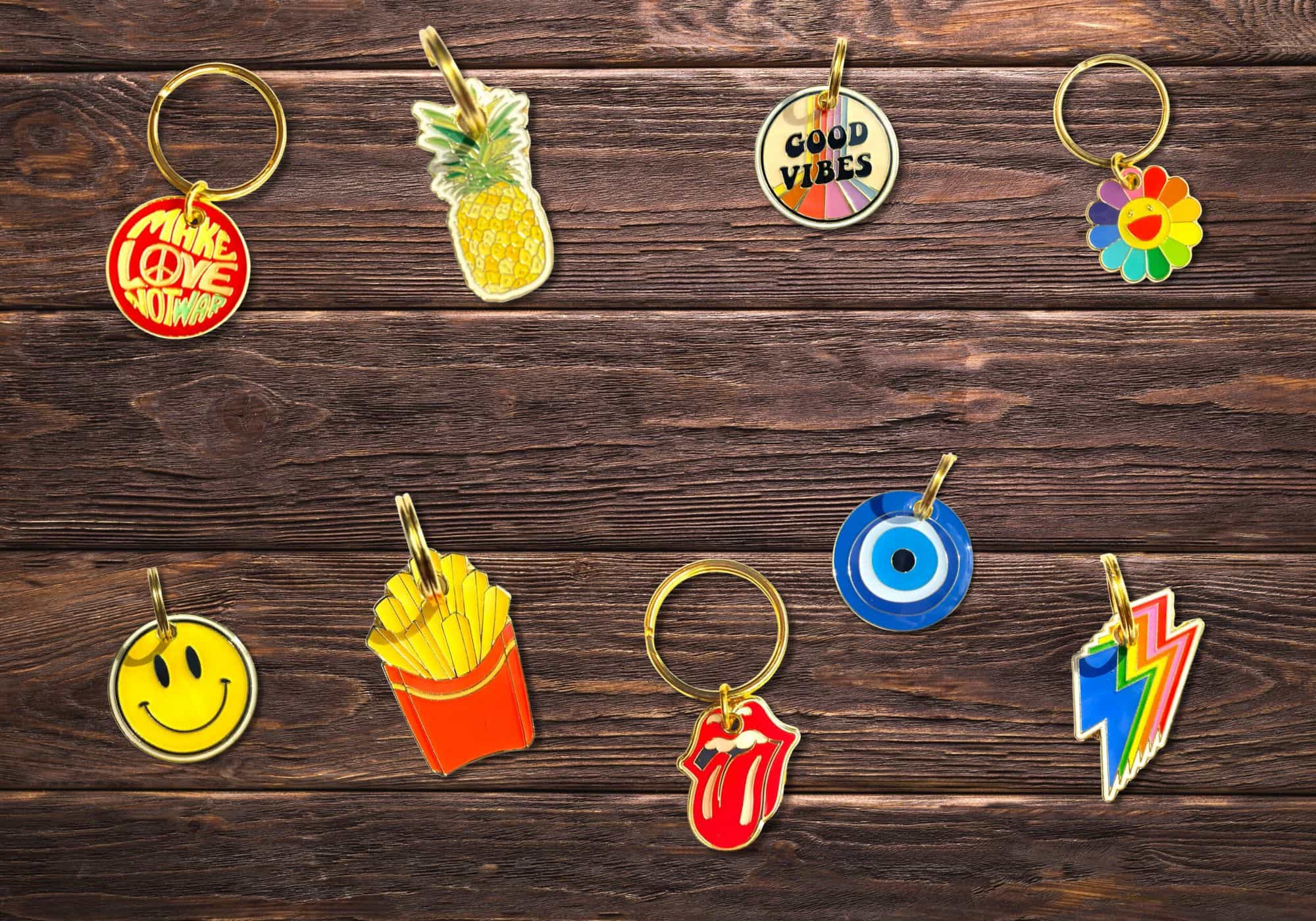 Collection of colorful keychains on a wooden surface