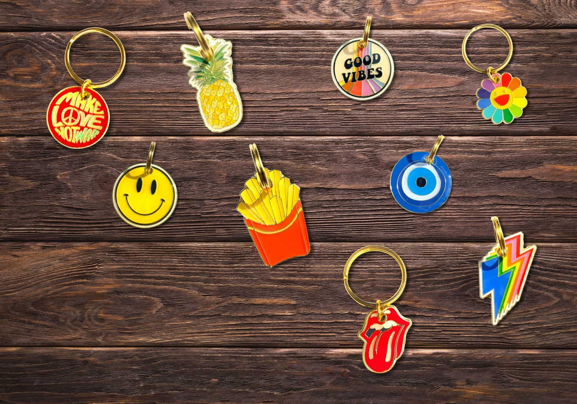 Collection of colorful keychains on a wooden surface
