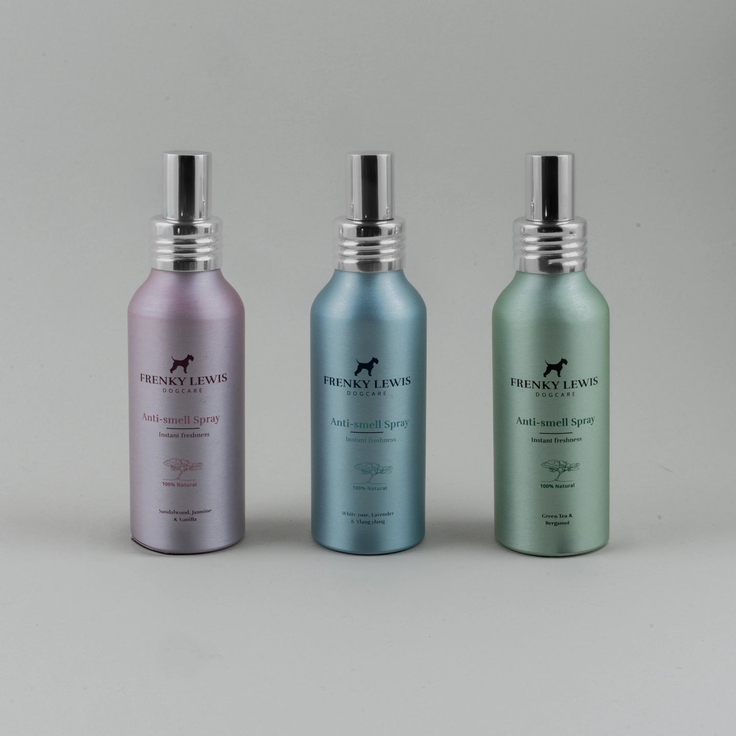 Three bottles of Frenky Lewis Anti-odor Spray on a gray background