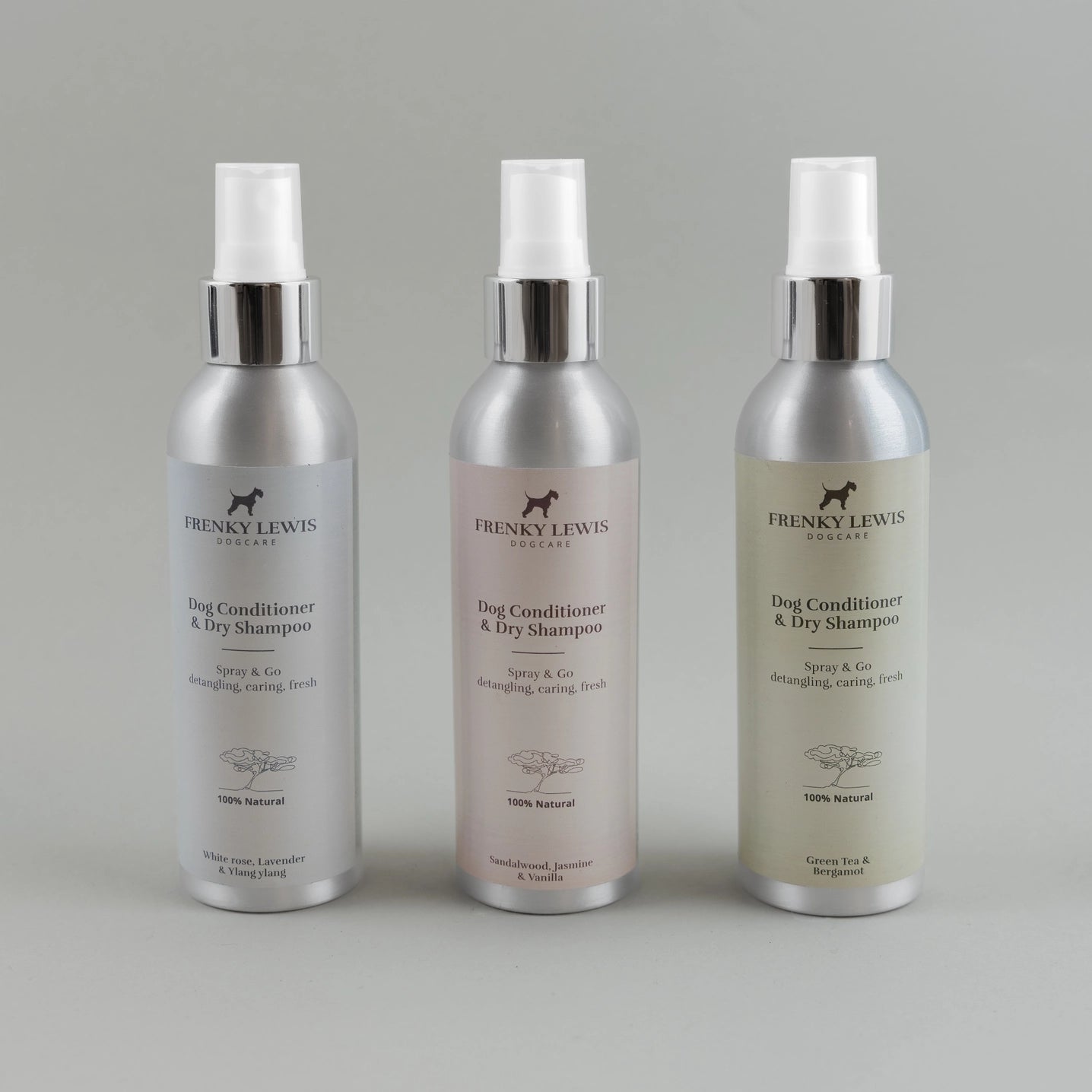 Three bottles of Frenky Lewis dog conditioner and dry shampoo on a gray background